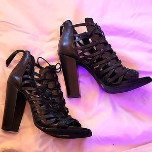 Black leather size 10 Jessica Simpson high heeled sandals.